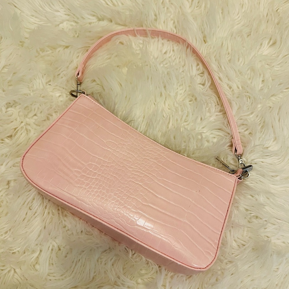 Pink crocodile effect clutch purse